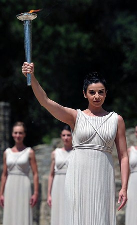 ATHENS, GREECE - MAY 10: High Priestess Ino Menegaki lights the Olympic flame at the Temple of Hera during the Lighting Ceremony of the Olympic Flame at Ancient Olympia on May 10, 2012 in Olympia, Greece. (Photo by Jamie McDonald/Getty Images)