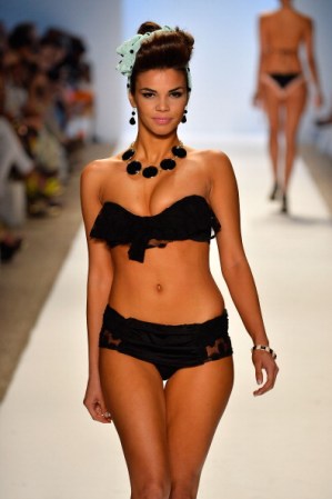MIAMI, FL - JULY 20: A model walks the runway at the Nicolita show during Mercedes-Benz Fashion Week Swim 2014 at Oasis at the Raleigh on July 20, 2013 in Miami, Florida. (Photo by Frazer Harrison/Getty Images for Mercedes-Benz Fashion Week Swim 2014)