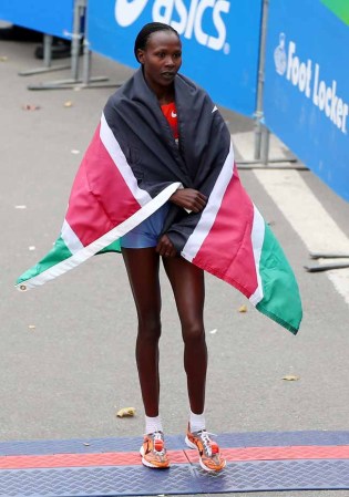 NEW YORK, NY - NOVEMBER 03: Priscah Jeptoo of Kenya celebrates after she won the 2013 ING New York City Marathon on November 3, 2013 in New York City. (Photo by Elsa/Getty Images)
