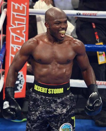 LAS VEGAS, NV - OCTOBER 12: WBO welterweight champion Timothy Bradley Jr. looks back towards Juan Manuel Marquez's corner at the end of the fifth round of their bout at the Thomas & Mack Center on October 12, 2013 in Las Vegas, Nevada. Bradley won in a split decision. (Photo by Ethan Miller/Getty Images)