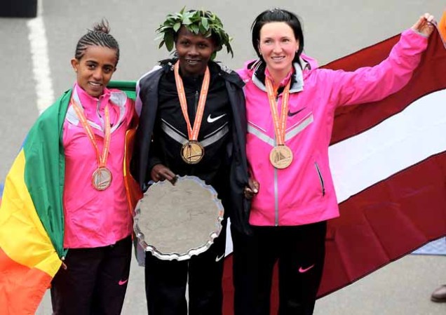 NEW YORK, NY - NOVEMBER 03: Buzunesh Deba of Ethiopia, Priscah Jeptoo of Kenya and Jelena Prokopcuka of Latvia pose after the awards ceremony during the 2013 ING New York City Marathon on November 3, 2013 in New York City. (Photo by Elsa/Getty Images)