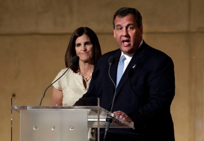 NEW YORK, NY - MAY 15: New Jersey Gov. Chris Christie (R), accompanied by his wife Mary Pat Christie, delivers his remarks during the dedication ceremony in Foundation Hall at the National September 11 Memorial Museum at ground zero May 15, 2014 in New York City. The museum spans seven stories, mostly underground, and contains artifacts from the attack on the World Trade Center Towers on September 11, 2001 that include the 80-foot high tridents, the so-called "Ground Zero Cross," the destroyed remains of Company 21's New York Fire Department Engine as well as smaller items such as letter that fell from a hijacked plane and posters of missing loved ones projected onto the wall of the museum. The museum will open to the public on May 21. (Photo by Richard Drew-Pool/Getty Images)