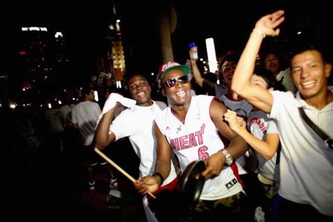 MIAMI, FL - JUNE 20: Fans react after the Miami Heat won the NBA title against the San Antonio Spurs June 20, 2013 in Miami, Florida. The Heat won back to back championships. (Photo by Joe Raedle/Getty Images)