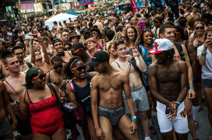 NEW YORK, NY - AUGUST 05: Revelers wearing only their underwear dance in Times Square in an attempt to break a Guinness Book of World Records' record for "the most amount of people gathered in their underwear in the Times Square section of New York" on August 5, 2013 in New York City. Organizers were hoping to get 2,271 people to strip down to their underwear - the current record is 2,270. (Photo by Andrew Burton/Getty Images)