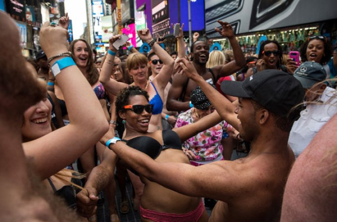 NEW YORK, NY - AUGUST 05: Revelers wearing only their underwear dance in Times Square in an attempt to break a Guinness Book of World Records' record for "the most amount of people gathered in their underwear in the Times Square section of New York" on August 5, 2013 in New York City. Organizers were hoping to get 2,271 people to strip down to their underwear - the current record is 2,270. (Photo by Andrew Burton/Getty Images)