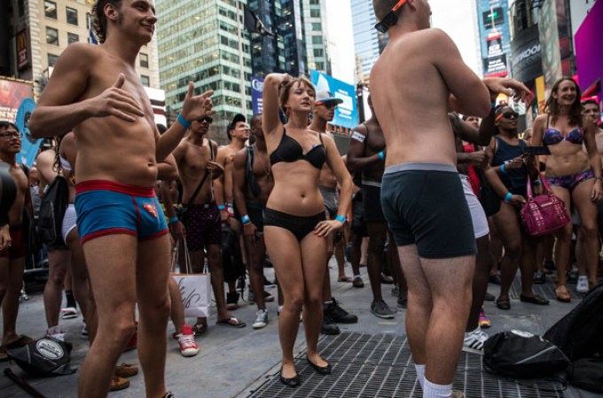 NEW YORK, NY - AUGUST 05: Revelers wearing only their underwear dance in Times Square in an attempt to break a Guinness Book of World Records' record for "the most amount of people gathered in their underwear in the Times Square section of New York" on August 5, 2013 in New York City. Organizers were hoping to get 2,271 people to strip down to their underwear - the current record is 2,270. (Photo by Andrew Burton/Getty Images)