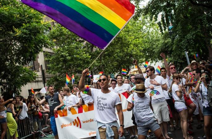 NEW YORK, NY - JUNE 30: Revelers march in the New York Gay Pride Parade on June 30, 2013 in New York City. This year's parade was a particularly festive occasion, due to the recent Supreme Court Ruling that it was unconstitutional to ban gay marriage. (Photo by Andrew Burton/Getty Images)