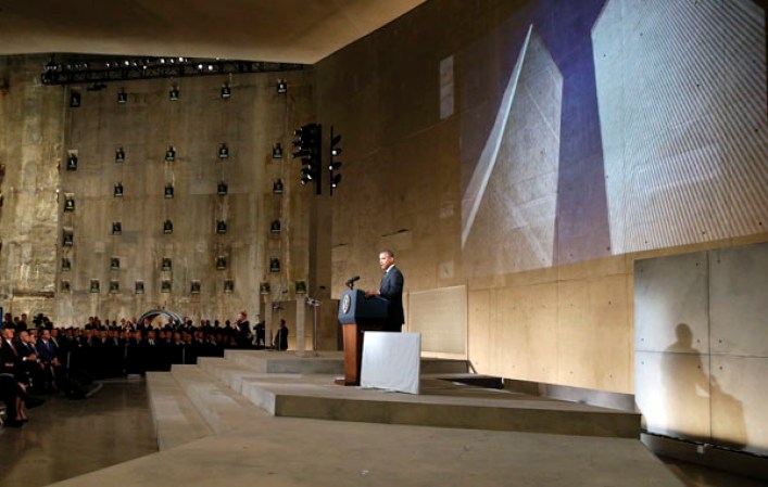 NEW YORK, NY - MAY 15: U.S. President Barack Obama speaks during the opening ceremony for the National September 11 Memorial Museum at ground zero May 15, 2014 in New York City. The museum spans seven stories, mostly underground, and contains artifacts from the attack on the World Trade Center Towers on September 11, 2001 that include the 80 ft high tridents, the so-called "Ground Zero Cross," the destroyed remains of Company 21's New York Fire Department Engine as well as smaller items such as letter that fell from a hijacked plane and posters of missing loved ones projected onto the wall of the museum. The museum will open to the public on May 21. (Photo by Mike Segar-Pool/Getty Images)