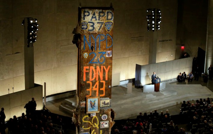 NEW YORK, NY - MAY 15: U.S. President Barack Obama speaks during the opening ceremony for the National September 11 Memorial Museum at ground zero May 15, 2014 in New York City. The museum spans seven stories, mostly underground, and contains artifacts from the attack on the World Trade Center Towers on September 11, 2001 that include the 80 ft high tridents, the so-called "Ground Zero Cross," the destroyed remains of Company 21's New York Fire Department Engine as well as smaller items such as letter that fell from a hijacked plane and posters of missing loved ones projected onto the wall of the museum. The museum will open to the public on May 21. (Photo by John Angelillo-Pool/Getty Images)
