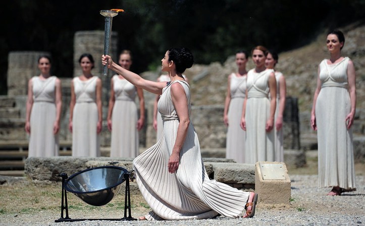 ATHENS, GREECE - MAY 10: High Priestess Ino Menegaki lights the Olympic flame at the Temple of Hera during the Lighting Ceremony of the Olympic Flame at Ancient Olympia on May 10, 2012 in Olympia, Greece. (Photo by Jamie McDonald/Getty Images)