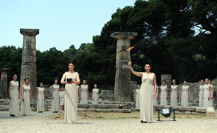 ATHENS, GREECE - MAY 10: High Priestess Ino Menegaki lights the Olympic flame at the Temple of Hera during the Lighting Ceremony of the Olympic Flame at Ancient Olympia on May 10, 2012 in Olympia, Greece. (Photo by Jamie McDonald/Getty Images)