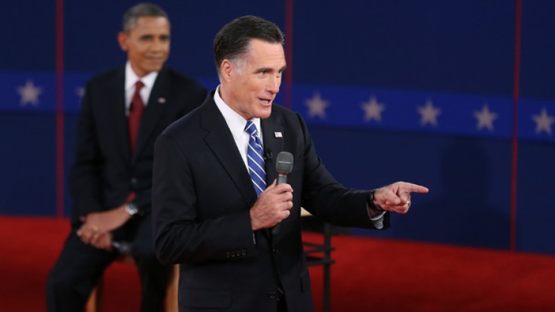 HEMPSTEAD, NY - OCTOBER 16: Republican presidential candidate Mitt Romney (R) speaks as U.S. President Barack Obama listens during a town hall style debate at Hofstra University October 16, 2012 in Hempstead, New York. During the second of three presidential debates, the candidates fielded questions from audience members on a wide variety of issues. (Photo by Bruce Bennett/Getty Images)