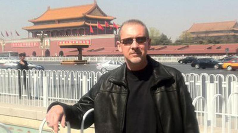 Wood, un ejecutivo de IBM que trabajó en Beijing, había regresado a ver a sus familiares en Keller, Texas, antes de partir a su siguiente trabajo en Kuala Lumpur, Malaysia.