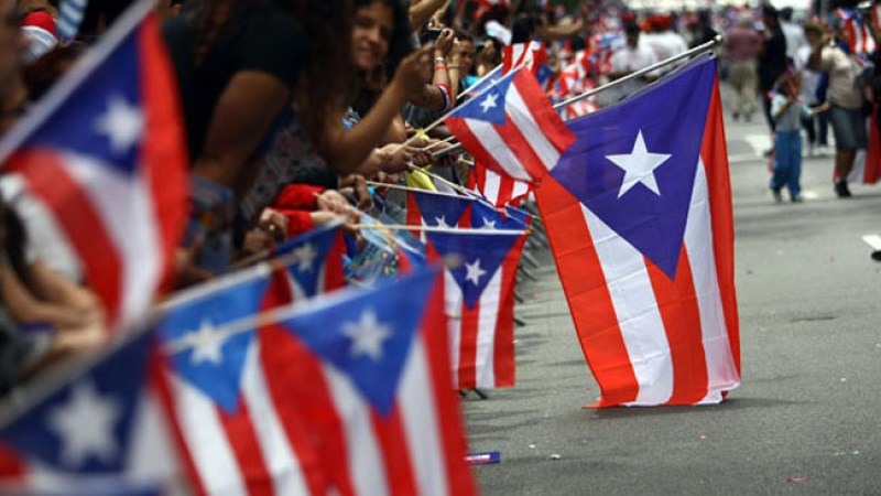 NEW YORK - JUNE 14: Revelers celebrate during the 2009 Puerto Rican Day Parade on the streets of Manhattan on June 14, 2009 in New York City. (Photo by Neilson Barnard/Getty Images)