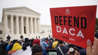 Immigration rights activists take part in a rally in front of the US Supreme Court in Washington, DC on November 12, 2019. - The US Supreme Court hears arguments on November 12, 2019 on the fate of the "Dreamers," an estimated 700,000 people brought to the country illegally as children but allowed to stay and work under a program created by former president Barack Obama.Known as Deferred Action for Childhood Arrivals or DACA, the program came under attack from President Donald Trump who wants it terminated, and expired last year after the Congress failed to come up with a replacement.