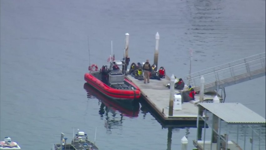 Several suspected undocumented immigrants are detained after they were spotted on a panga boat off Point Loma on Monday, May 17, 2021.