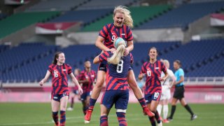 The U.S. women's soccer team celebrates in their game against New Zealand