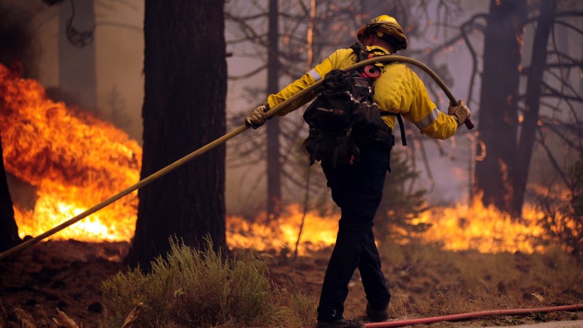 MEYERS, CA – AUGUST 31: Firefighters try to extinguish the Caldor Fire as it continues in Meyers, California, United States on August 31, 2021. (Photo by Neal Waters/Anadolu Agency via Getty Images)