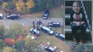 Police searching a park in Abington, Massachusetts, on Friday, Oct. 22, 2021, in the investigation into the disappearance of Elijah Lewis, a 5-year-old boy from Merrimack, New Hampshire (seen inset).