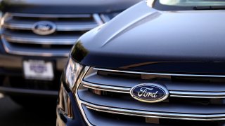 The Ford logo is displayed on a new Ford car on the sales lot at a Ford dealership on March 29, 2017 in Colma, California.