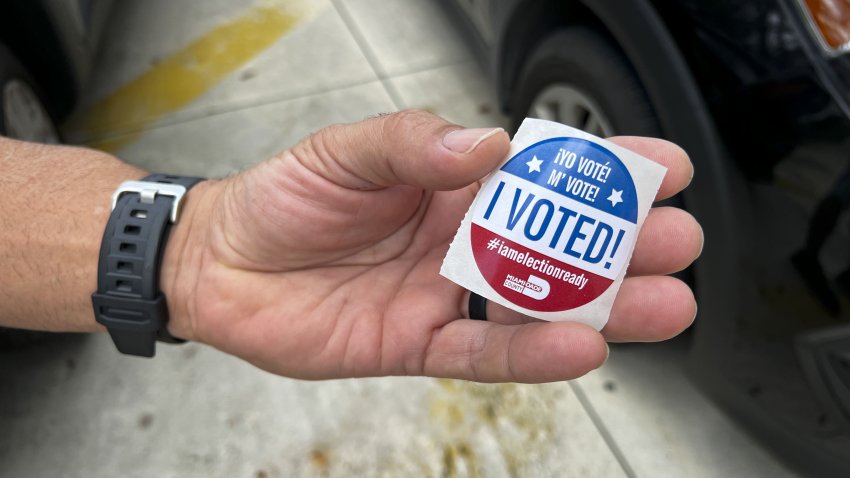 A voter holds an “I Voted” sticker at a polling location in Miami, Florida, US, on Tuesday, Aug. 23, 2022. Republican Florida Governor Ron DeSantis, running unopposed in Tuesdays primary as he goes for a second term, has amassed $142 million from the start of 2021 through August 5 this year from donors including the hedge fund billionaires Ken Griffin and Paul Tudor Jones. Photographer: Eva Marie Uzcategui/Bloomberg via Getty Images