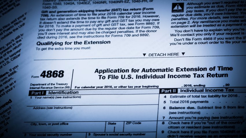 A stock photo of IRS Form 4868 Tax Extension form. Perfect for designs or articles about accounting, finances, taxes or filling an income tax extension. Photographed using the Canon EOS 5DSR and Canon 100mm 2.8 Macro lens.