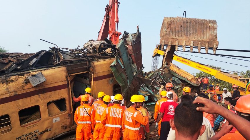 Members of the National Disaster Response Force (NDRF) conduct rescue operation at the site of train crash in Vizianagaram district of India’s Andhra Pradesh state on October 30, 2023. At least 13 people were killed and around 50 injured after two trains collided in southeast India, officials said on October 30, updating an earlier toll of eight.