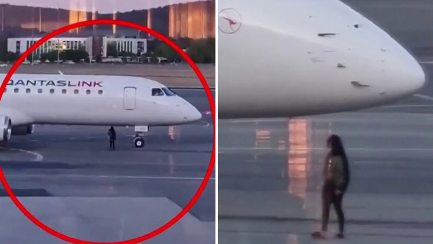 mujer intenta abordar un avión en la pista de aterrizaje en Canberra, Australia