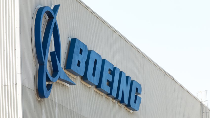 Renton, Washington / USA – July 31 2019:  “Boeing” sign on the exterior of the 737 MAX airliner factory in Renton, home to the 737 MAX 8, MAX 9, and MAX 10 production lines, with space for text