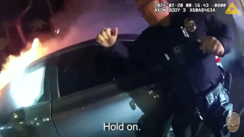 Police body camera footage shows officers respond to a fiery car crash in Encino on Feb. 20, 2024.