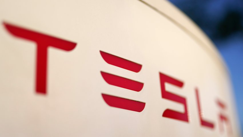 FILE – The logo for the Tesla Supercharger station is seen in Buford, Ga, April 22, 2021. Faced with falling global sales and a tumbling stock price, Tesla has slashed prices again on some of its electric vehicles and its “Full Self Driving” system. Tesla releases first-quarter earnings Tuesday, April 23, 2024. (AP Photo/Chris Carlson, File)