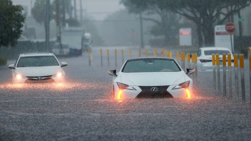 AVENTURA, FLORIDA – JUNE 12: Stalled vehicles sit in a flooded street on June 12, 2024 in Aventura, Florida. The region is being adversely impacted as tropical moisture passes through the area. (Photo by Joe Raedle/Getty Images)