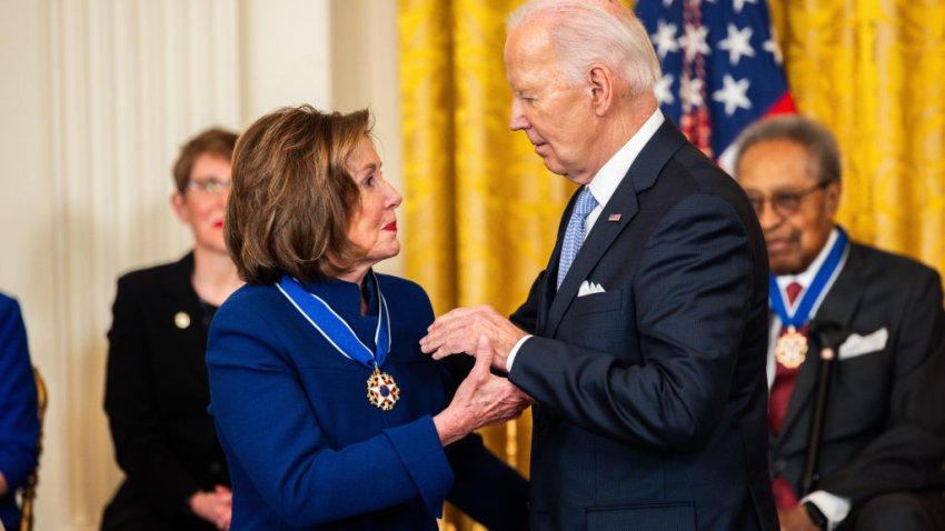 US President Joe Biden, center right, and Representative Nancy Pelosi, a Democrat from California, during a medal of freedom ceremony in the East Room of the White House in Washington, DC, US, on Friday, May 3, 2024. The Presidential Medal of Freedom is the nation’s highest civilian honor, presented to individuals who have made exemplary contributions to the prosperity, values, or security of the United States. Photographer: Tierney L. Cross/Bloomberg via Getty Images