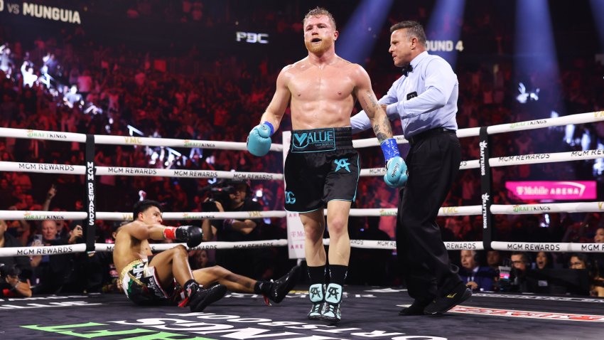 LAS VEGAS, NEVADA – MAY 04: Canelo Alvarez of Mexico (R) knocks down Jaime Munguia (L) during their super middleweight title fight at T-Mobile Arena on May 04, 2024 in Las Vegas, Nevada. (Photo by Cris Esqueda/Golden Boy/Getty Images)