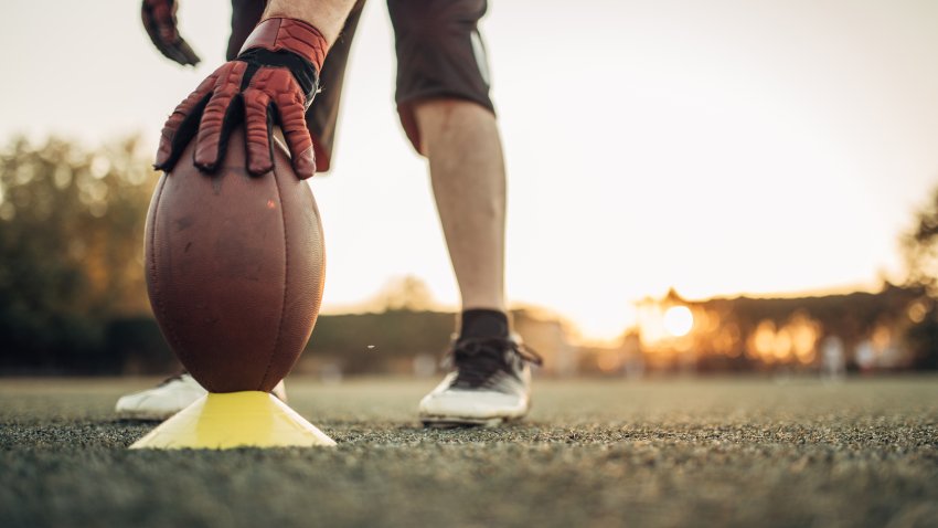 One man, American football player on training outdoors.