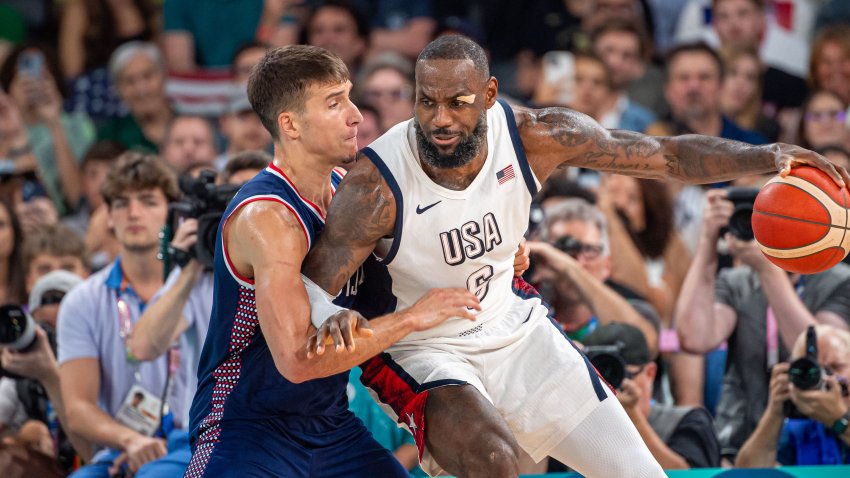 PARIS, FRANCE – AUGUST 8: LeBron James #6 of United States competes against Bogdan Bogdanovic #7 of Serbia during a Men’s basketball semifinals match between Team United States and Team Serbia on day thirteen of the Olympic Games Paris 2024 at Bercy Arena on August 08, 2024 in Paris, France. (Photo by RvS.Media/Robert Hradil/Getty Images)