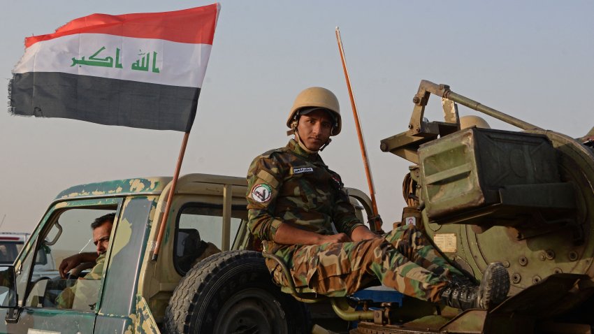 Iraqi forces, supported by members of the Hashed al-Shaabi (Popular Mobilisation), advance in al-Hadar desert on June 18, 2023, as they search for remnants of the Islamic State (IS) group. (Photo by Zaid AL-OBEIDI / AFP) (Photo by ZAID AL-OBEIDI/AFP via Getty Images)