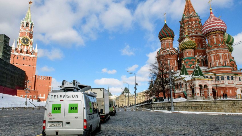 Russia’s state-controlled Russia Today (RT) television broadcast vans are seen parked in front of St. Basil’s Cathedral and the Kremlin next to Red Square in Moscow on March 16, 2018. Russia will vote for President on March 18. (Photo by Mladen ANTONOV / AFP) (Photo by MLADEN ANTONOV/AFP via Getty Images)