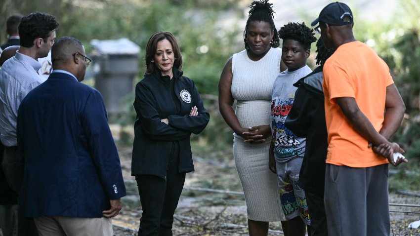 US Vice President Kamala Harris speaks with community members as she surveys the damage from Hurricane Helene, in the Meadowbrook neighborhood of Augusta, Georgia, on October 2, 2024. US President Joe Biden and Vice President Kamala Harris on Wednesday witnessed first-hand the catastrophic destruction wrought by Hurricane Helene, as several thousand responders joined all-out efforts to rescue residents and care for millions impacted by the storm. (Photo by Brendan SMIALOWSKI / AFP) (Photo by BRENDAN SMIALOWSKI/AFP via Getty Images)