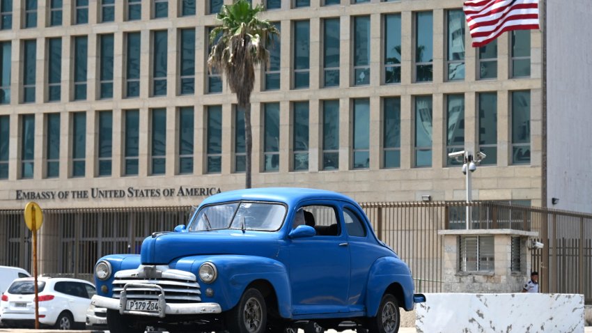 A car drives past the US embassy in Havana, on March 18, 2024. The chargé d’affaires of the US embassy in Havana, Benjamin Ziff, was summoned to the Cuban Foreign Ministry to rail against “interfering conduct” even as Washington denied involvement in weekend protests against the blackouts and food shortages in Santiago de Cuba, and said they were symptomatic of a “dire situation” in the communist nation. (Photo by YAMIL LAGE / AFP) (Photo by YAMIL LAGE/AFP via Getty Images)