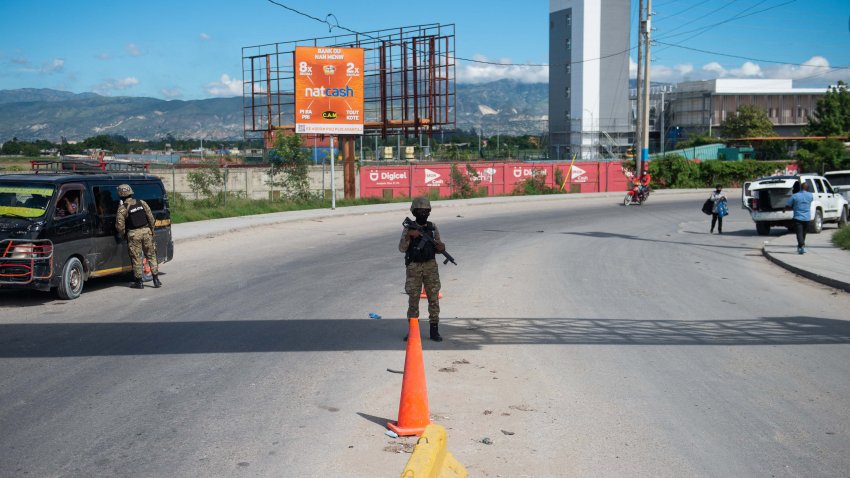 Police officers patrol near the Toussaint Louverture International Airport in Port-au-Prince, Haiti, on November 12, 2024. The United States’ aviation regulator banned on Tuesday all civilian flights from the country to Haiti for a period of 30 days, a day after a gun attack on a passenger jet at the Port-au-Prince airport. (Photo by Clarens SIFFROY / AFP) (Photo by CLARENS SIFFROY/AFP via Getty Images)