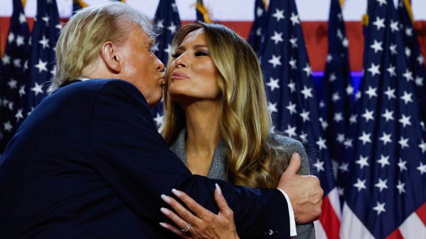 WEST PALM BEACH, FLORIDA – NOVEMBER 06:  Republican presidential nominee, former U.S. President Donald Trump kisses former first lady Melania Trump as he arrives to speak during an election night event at the Palm Beach Convention Center on November 06, 2024 in West Palm Beach, Florida. Americans cast their ballots today in the presidential race between Republican nominee former President Donald Trump and Vice President Kamala Harris, as well as multiple state elections that will determine the balance of power in Congress.   (Photo by Chip Somodevilla/Getty Images)