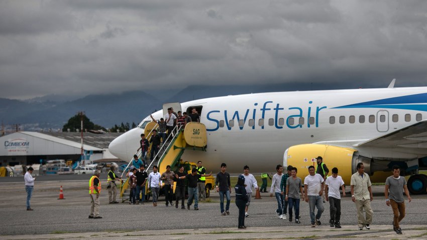 GUATEMALA CITY, GUATEMALA – MAY 30: Guatemalan men walk from a deportation flight, chartered by the U.S. Government, after being sent back from the United States on May 30, 2019 in Guatemala City, Guatemala. U.S. Immigration and Customs Enforcement (ICE) deports some 2,000 people per week to Guatemala from various U.S. cities. (Photo by John Moore/Getty Images)