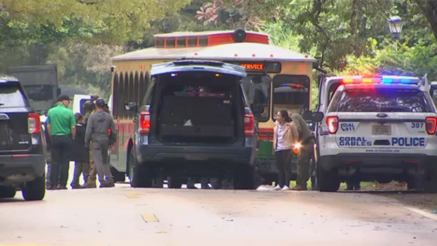 Multiple people were seen being taken into custody in Coral Gables Friday as part of an investigation involving multiple local and federal law enforcement agencies.