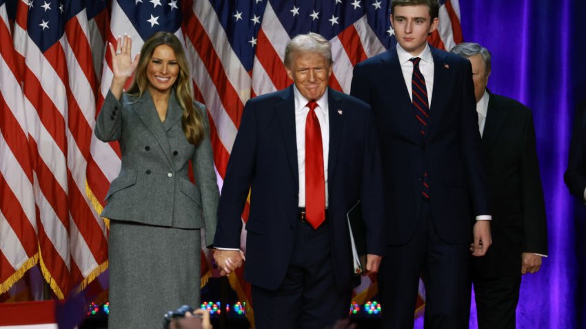 WEST PALM BEACH, FLORIDA – NOVEMBER 06:  Republican presidential nominee, former U.S. President Donald Trump arrives to speak with former first lady Melania Trump and Barron Trump during an election night event at the Palm Beach Convention Center on November 06, 2024 in West Palm Beach, Florida. Americans cast their ballots today in the presidential race between Republican nominee former President Donald Trump and Vice President Kamala Harris, as well as multiple state elections that will determine the balance of power in Congress.   (Photo by Joe Raedle/Getty Images)