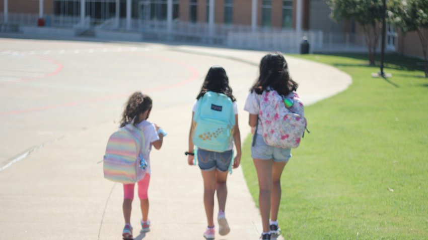 girls back to school during pandemic covid 19 coronavirus playground face mask oriental middle east us immigrants