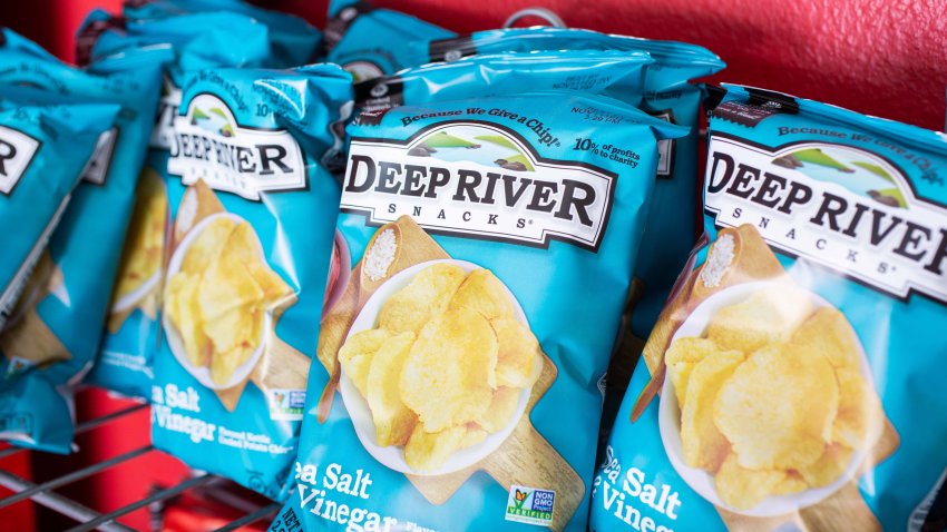 Murrieta, California/United States – 09/04/2019: Several small bags of Deep River Snacks Sea Salt & Vinegar flavor potato chips on a shelf at a convenient store