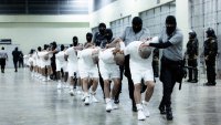 SAN SALVADOR, EL SALVADOR – MARCH 16: (—-EDITORIAL USE ONLY – MANDATORY CREDIT – ‘EL SALVADOR PRESIDENCY / HANDOUT’ – NO MARKETING NO ADVERTISING CAMPAIGNS – DISTRIBUTED AS A SERVICE TO CLIENTS—-) More than 250 suspected gang members arrive in El Salvador by plane, including 238 members of Venezuela’s Tren de Aragua gang and 23 members of the MS-13 gang, who were deported to El Salvador by the US in San Salvador, El Salvador on March 16, 2025. El Salvador’s President Nayib Bukele confirmed they will be sent to the country’s infamous mega-prison at CECOP facility prison. San Salvador forces took heavy security measures. (Photo by El Salvador Presidency / Handout/Anadolu via Getty Images)