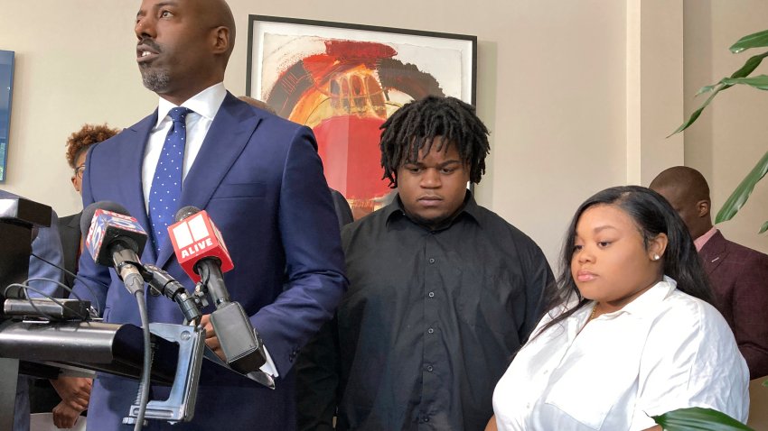 CORRECTS ID AT LEFT TO CORY LYNCH, NOT RODERICK EDMOND – Attorney Cory Lynch, left, joined by Treveon Isaiah Taylor, Sr., Jessica Ross, speaks during a news conference, Wednesday, Aug. 9, 2023, in Atlanta, announcing a lawsuit against a doctor and Southern Regional Medical Center, a hospital south of Atlanta where Ross went on July 9 to have her son. A doctor used too much force and decapitated Ross’s baby during delivery according to the lawsuit filed Wednesday, the attorneys said.  (AP Photo/Sudhin Thanawala)