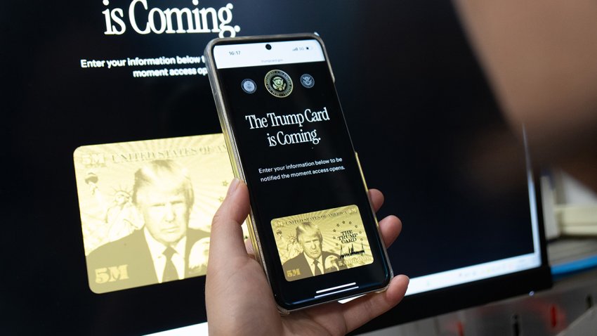 SHANGHAI, CHINA – JUNE 12: A netizen holds a smartphone displaying the website for registering interest in the new gold card visa on June 12, 2025 in Shanghai, China. U.S. President Donald Trump’s long-touted “gold card,” which offers foreigners a path to U.S. citizenship after paying $5 million to the government, is open for business. (Photo by Wang Gang/VCG via Getty Images)